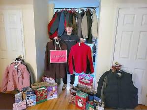 Hunter Stuart with “Helmets to Boots” donations to veterans.