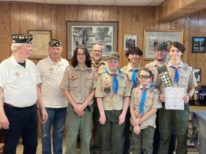 L-R: Legion Post 214 Commander Tom Brennan; Past American Legion County Commander Frank Gilner; boy scout Harry Anderson; scout Chair Scott Brown; scouts Jack Castellano, Holden Frommeyer, and T.J. Brown; scout leader Tim Brown; and senior patrol leader Aiden Anderson.