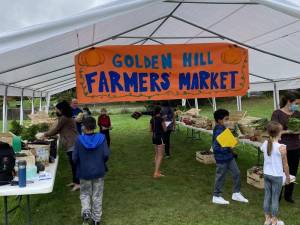 Fifth-grade students painted the Golden Hill Farmers Market sign that hung across the tent. Photos provided by the Florida School District.