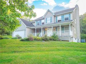 Stately Warwick Colonial on serene wooded property