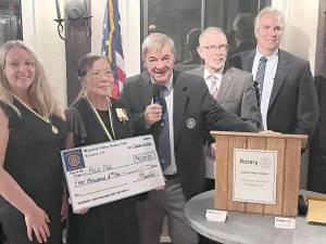 Warwick Valley Rotary President Laura Barca presents Carole Tjoa, Rotary District PolioPlus Chair, with a $4,000 donation to Rotary International’s effort to eliminate polio worldwide. The funds were raised from this year’s recent ceremony which honored Michael Sweeton, second from right, as Warwick’s 2022-2023 Citizen of the Year and Jenna Price and Barbara Katz for Outstanding Community Service. Shown, left to right, are Laura Barca, Carole Tjoa, Stan Martin, Michael Sweeton and Leo Kayes, Jr.