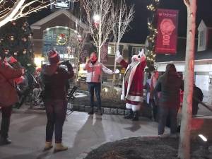 Santa greets shoppers during last year's tree lighting at Woodbury Common Premium Outlets in Central Valley. This year's lighting takes place Friday, Dec. 6