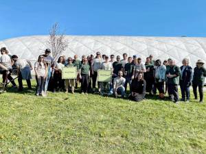 A crowd of about 50 people gathered to celebrate and help plant five trees at Transformation Trails in Warwick.