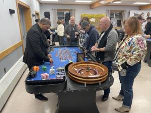 Roulette and craps players at Casino Night. (Photo by Peter Lyons Hall)