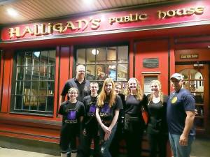 Pictured from left to right are: Finn Maxcy; Brian Smith, co-owner of Halligan's; Connor Holland; Olivia Holland; Christina Davin; Liana Kennedy; Colleen Smith; and Rich Bailey, co-owner of Halligan's.