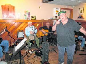 Duke Hoffman sings along to the Irish music being played during the session.