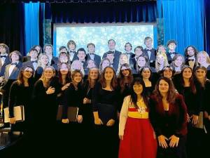 Yuri Nam, in red in front, with WVHS Choral Director Noreen Hanson