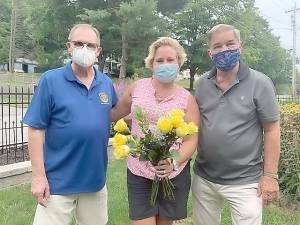 Rotarians David Dempster, left, Rose Chair Joyce Perron, center, and Stan Martin assemble roses for first responders and senior citizens in Warwick. Photos provided by Warwick Valley Rotary.
