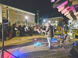 Members of the Warwick community gathered on Railroad Green to hold a peace vigil.