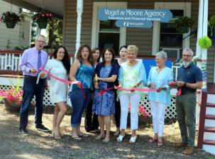 On July 30, Mayor Michael Newhard (right) and members of the Warwick Valley Chamber joined Vogel &amp; Moore Insurance owner Ann Marie Moore, her mother and founder Ann Vogel (center) and staff for a ceremony to celebrate the firm's 40th anniversary.