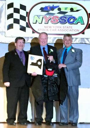 Provided photos Rich Eurich is flanked by Lebanon Valley Speedway representative Brian Bedell on his left and NYSSCA President John Keegan to his right during his induction into the New York State Stock Car Association Hall of Fame.