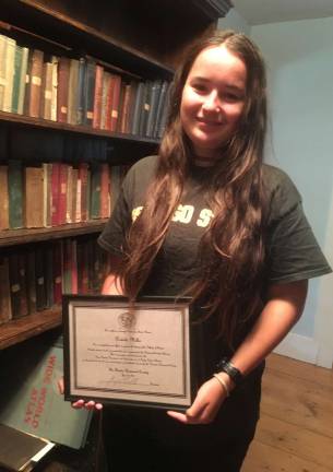 Provided photo The Florida Historical Society&#x2019;s yearly award to a deserving S.S. Seward Institute student went to Natalie Miller for her efforts in designing and creating a library for four generations of books dating back to the early 1800s in the Green Family Homestead.