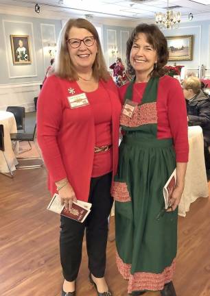Catholic Charities board members Susan Murray-Tetz (left) and Ginny Brown helped welcome some of the 450 guests as they arrived at the Harness Racing Museum to pick-up their guidebooks and enjoy the live music and refreshments.