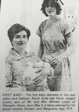 Image from a 1973 news article with Noreen Lowry holding Kevin Joseph, the first baby delivered at St. Anthony’s new Labor and Delivery Room Suite.