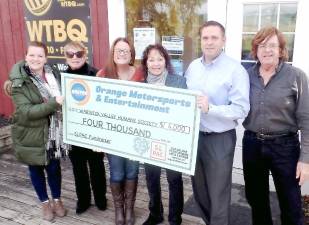 From left, Lorraine Steadman of Orange County Motorsports Entertainment; WTBQ manager Taylor Sterling; Amy Smith of OCME; Suzyn Barron, president of the Warwick Valley Humane Society; Orange County Executive Steve Neuhaus; and WTBQ owner Frank Truatt.