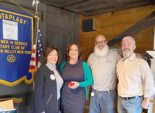 Guest speakers Carmela Borrazas from Hugs for Courage - Volunteers and VFW Commander John MacDonald informed Warwick Valley Rotarians of a new program being organized to assist Warwick veterans and first responders with counseling and therapy treatment for those struggling with mental illness and PTSD. Shown, left to right, are Warwick Rotary President Tina Russo Buck, Borrazas, Rotarian Wayne Patterson and MacDonald.