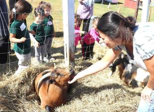 Monica Pennings welcomes the children who especially enjoy the family's pet goats.