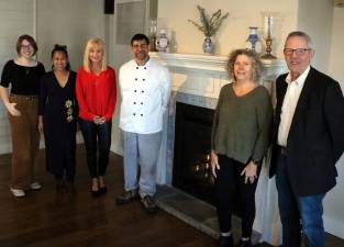 Gathered around the fireplace in anticipation of The Warwick Valley Chamber of Commerce’s Dec. 1 holiday event are, from left, Warwick Valley Chamber of Commerce Programs Public Relations Coordinator Olivia DiCostanzo, Committee Member Ia Faroni, Programs Chair Janine Dethmers, Landmark Inn Chef/Owner Michael DiMartino, Chamber Business Manager Karen Wintrow and Executive Director Michael Johndrow. Photo by Roger Gavan.