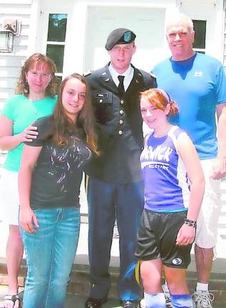 June 2013: West Point graduate home on leave with his family: From left, mother Ann Prial, his sister Brigid, U.S. Army Lt. Daniel Prial, his sister Jenny and father Greg Prial. Not available for the photo Prial’s sister Becky who is married and lives in New Paltz and his brother Terrance who works in Washington, D.C. Photo by Roger Gavan