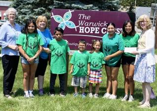 Pictured from left to right: Mimi Fader, president of the Shared Ministries of Hope Board; Kathy Brieger, WAFO Director, with children who attend the summer camp; Dulce Esperanza; and Laura Shanahan, drector The Warwick Hope Chest. Provided photo.