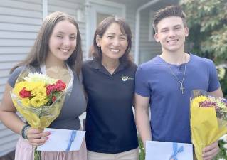 Dr. Haesin Jung, center, is pictured here with two of the three award-winners of “Smile Power Scholarship” sponsored by her office: Mikayla Beauregard and Luke Blumenberg. Provided photo.
