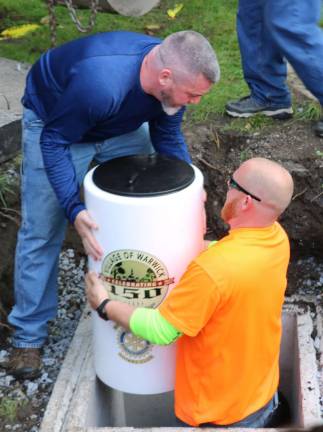 The Time Capsules were lowered by members of the Village of Warwick Department of Public Works (WPD).