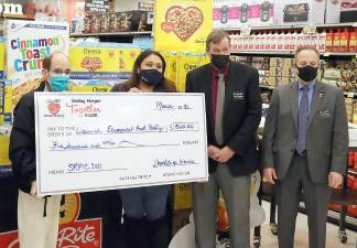 Store Manager Tom Donahue presented a check for $500 to Glenn P. Dickes, director of the Warwick Ecumenical Food Pantry. From left, Glenn P. Dickes, director of the Warwick Ecumenical Food Pantry, winner Gabriella Tapia. Store Manager Tom Donahue and Michael Schoendorf, vice president of ShopRite Operations. Winner Nicholas Jackson was not available for the photograph. Photos by Roger Gavan.