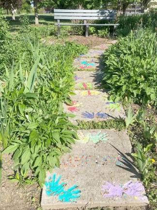 Colorful garden steps lead to local history