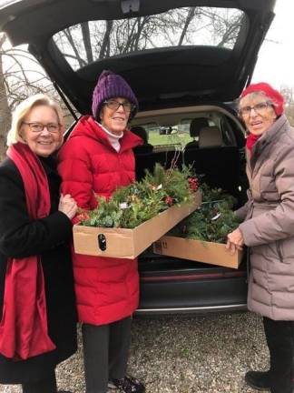 Members of the Orange and Dutchess Garden Club delivering greenery arrangements to Meals on Wheels of Warwick. Pictured from to right: Susan Metzger, Susie Hull and Jo Hull.