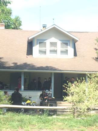 Actors and production crew members at the farm house used for the "Blindspot" TV show.
