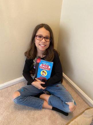 Fourth grade student Zoe Espinal of Monroe reads books to a group of more than 160 on Facebook live.