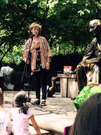 Storyteller Judith Heineman tells a Grimm's tale at the Hans Christian Andersen statue in Central Park. She will be the featured storyteller at the Florida Public Library's annual Fall Storytelling Cafe on Friday, Sept. 23, at 7 p.m.