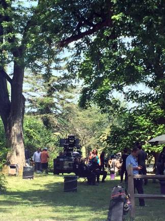 Production equipment and actors outside one of the fimiling locations.