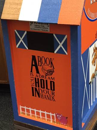 Kiwanis installs children's book box at village hall