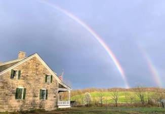 A sign of hope rises above the Gen. John Hathorn Historic Site in Warwick. Photo by Arek Kwapinski.