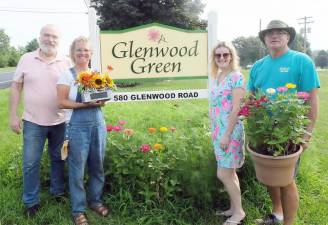 Members of the Pine Island Chamber of Commerce introduce Glenwood Green, a new outdoor event venue for the chamber’s Aug. 10 dinner. Pictured from left to right are: John Redman, event chairperson; Debbie Brunjes, florist; Susan McCosker, chamber president; and Leonard DeBuck, Glenwood Green owner. Provided photo,