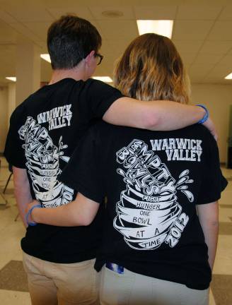 Warwick Valley High School volunteers wearing Empty Bowls T-shirts with the phrase, "Fighting hunger one bowl at a time." The design was created by WVHS alum Eliza Bender when she was a student.