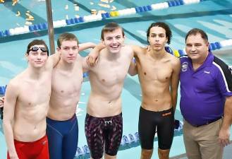 Warwick boys’ swim team members (l-r) Jesse Abramson, Connor Holland, Michael Kelly, Youssef Moustafa and Coach Frank Woodward. The relay team broke school records in the 200 freestyle relay and the 400 freestyle relay during the Section 9 preliminaries on Feb. 16, 2023.