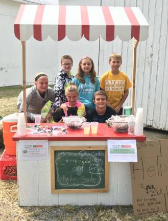 Provided photo Warwick Valley Middle School students recently held a bake sale at the Manno Farm to raise money for Hurricane Harvey victims in the Houston, Texas, area. Pictured in front, from left to right, are: Alexa Borner, Abby Tobin and Drew Borner, all ages 12; and in back: Rocco Manno, 12, Paige Manno, 10, and Declan Tobin, 12.