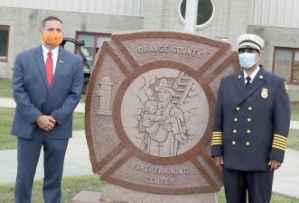 Orange County Executive Steven M. Neuhaus and Deputy Commissioner of Fire Services Vini Tankasali at the County’s Firefighter 1 on Tuesday, Sept. 1. Provided photos