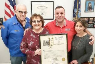 State Assemblyman Karl Brabenec recently presented Carol Schultz and her partner Richard O'Donnell, from the Village of Florida, with an Assembly proclamation which commemorates her tree donation as the Rockefeller Christmas Tree for 2019. Picture from left to right are: Richard O'Donnell, Carol Schultz, Assemblyman Karl Brabenec and Deputy Chief of Staff Suzanne Edzenga.
