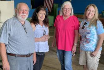 Pictured from left to right are: Jim Clifford,<b> </b>Susan Baresel, Village Trustee Nancy Clifford and artist Jill Lyons, the four Greenwood Lake residents who initiated the large scale mosaic project that is beginning to take shape in the Community Center on Waterstone Road. Photo by Peter Lyons Hall.