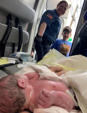 Officer Antonucci and brother Wyatt meet baby Juliana. Photo provided.