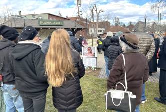 About 100 people gathered in Railroad Green on Jan. 11 for a vigil.
