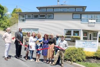 On Friday, May 14, Town of Warwick Supervisor Michael Sweeton(right), Mayor Michael Newhard,(left) members of the Warwick Valley Chamber of Commerce and Leon Dixon of TD Bank (2nd from left) joined owner Dr. Agnieszka Pindral (center) and her staff to celebrate the grand opening of Warwick Physical Therapy’s expanded location. Photo by Roger Gavan.