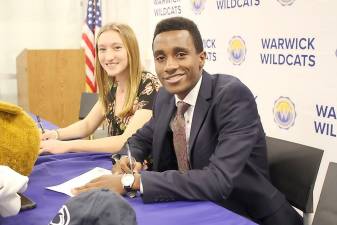 Warwick Valley High School seniors Caroline Fatta and Behailu Bekele-Arcuri signed their letters of intent to race competitively for the Binghamton Bearcats and Penn State Nittany Lions, respectively, during a ceremony on Nov. 26. Each of them thanked their families, coaches, teachers and friends for their support and helping them to succeed.