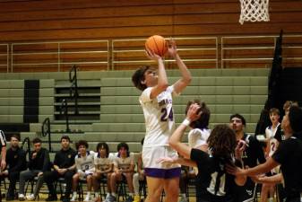 Warwick's Jake Cosco rises towards the hoop during a shot.