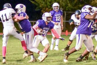 Warwick’s Dan Thorson (#20) runs behind junior tackle Christian Felix (#73) and sophomore Tight End Latrell Willis (81) in Wildcat win over Pine Bush last Friday, Oct. 29, at C. A. Morgan Field. Photo by Al Konikowski.