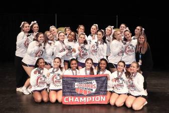 The Lady Wildcat cheerleaders celebrate as NCA champions.