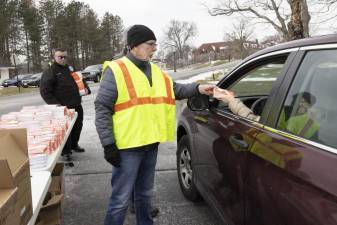 Warwick NY Town Supervisor Michael Sweeton handing out free covid test kits to Orange County, NY, residents at Wickham Woodlands Park on Friday.